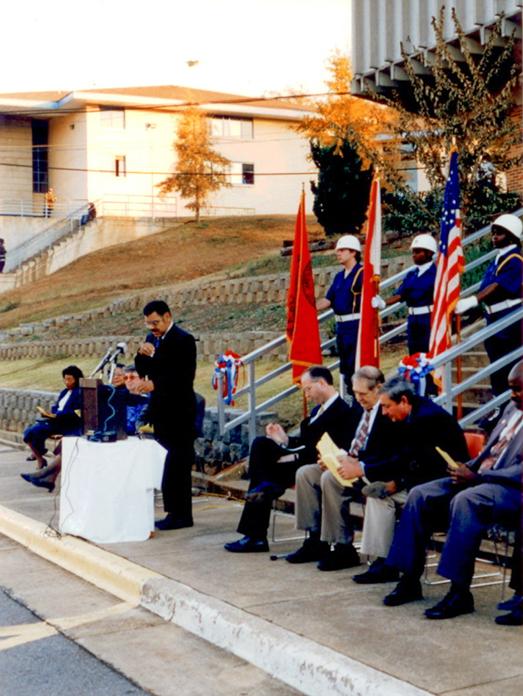 Eugene Ned Prater speaks during the ceremony attended by state and local government officials and community leaders.